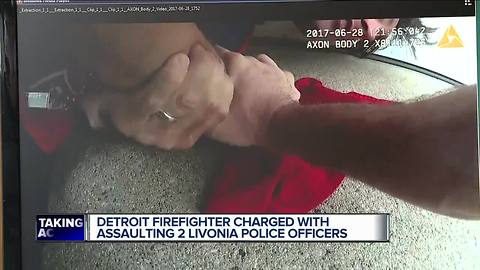 Firefighter charged in assault on officers