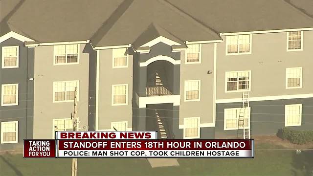 Orlando officer shot while responding to call, suspect barricaded with four children in apartment