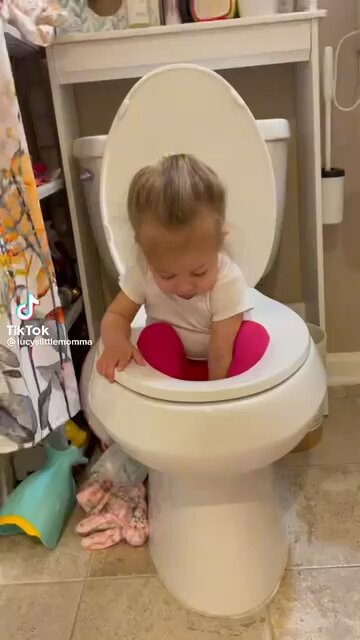 Little Girl Playing In The Toilet￼