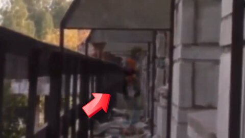 person dressed in orange is standing on the balcony of an abandoned facility [Ghost]