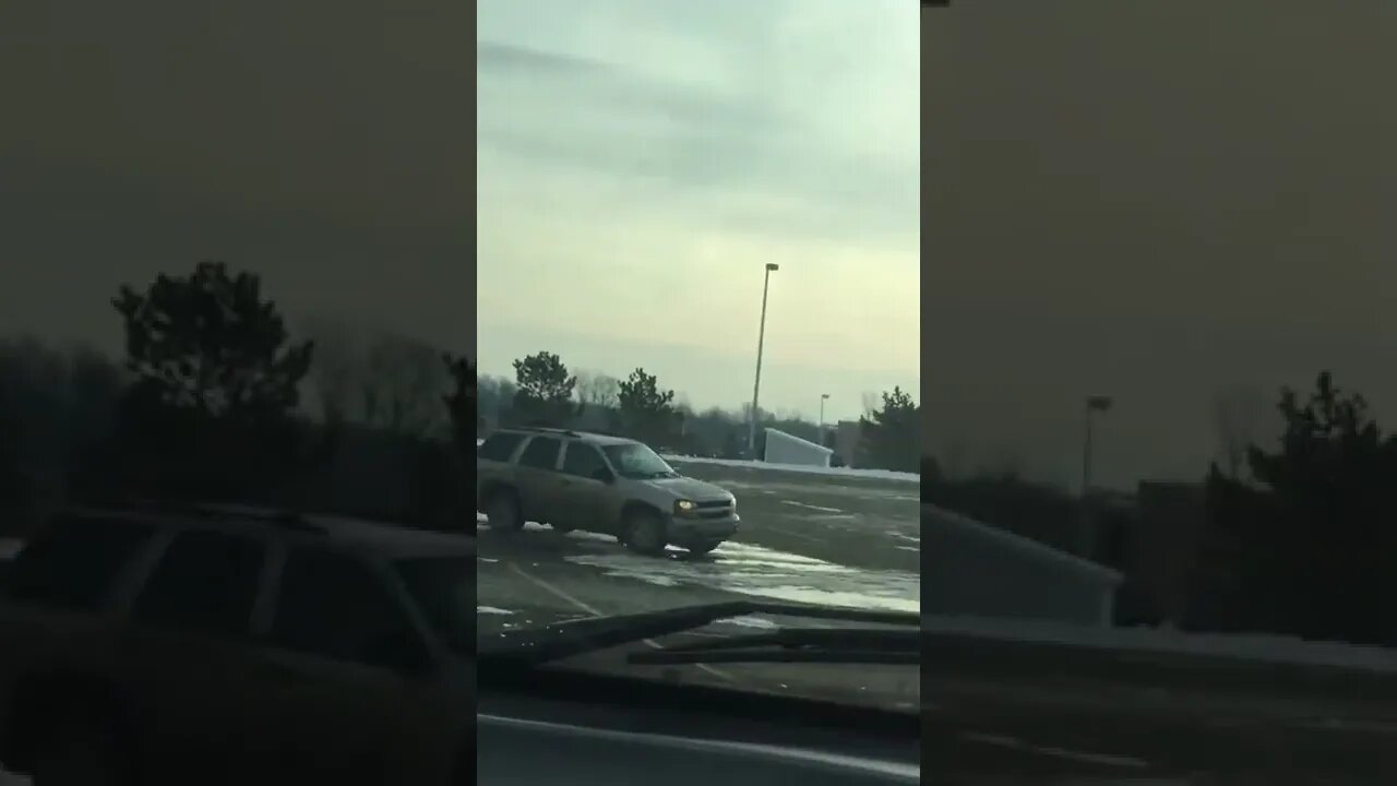 Guy Doing Donuts in School Parking Lot