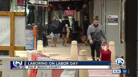 Food delivery workers brave rainy Labor Day