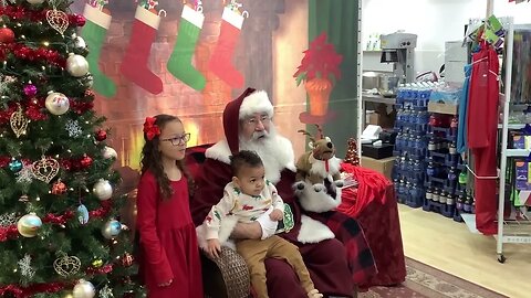 Santa visits with a family at Gift of Wings in Greendale, WI