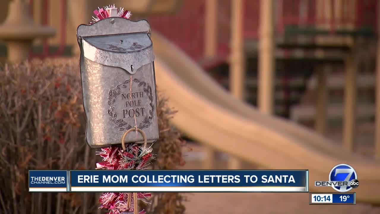 Woman in Erie collecting letters to Santa Claus with Christmas mailbox
