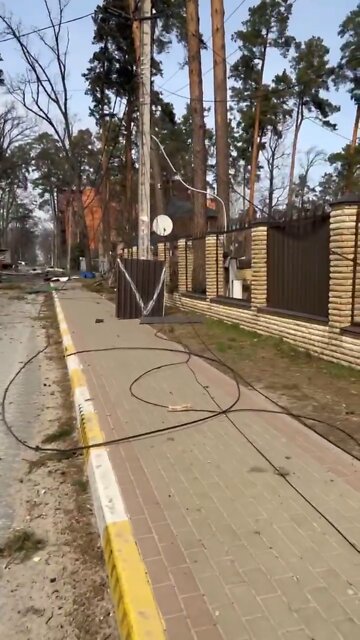 Ukrainian forces walk through devastated neighborhoods in Irpin Ukraine