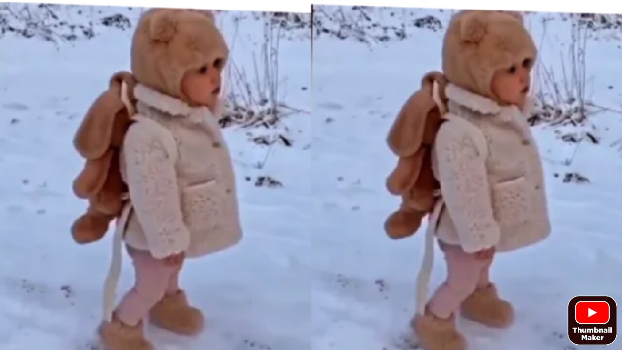 Baby dancing in a snow with music