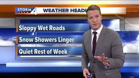Snow showers linger Tuesday