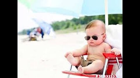 Funny baby reaction on the beach