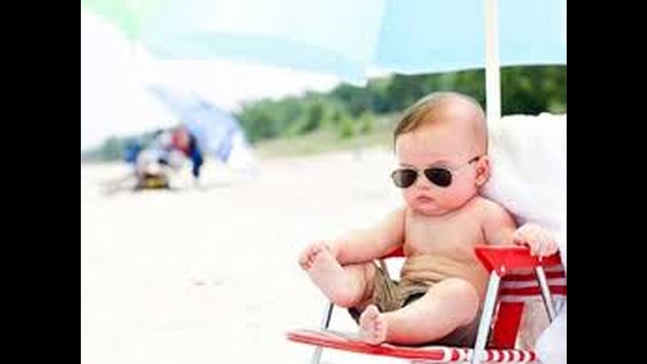 Funny baby reaction on the beach