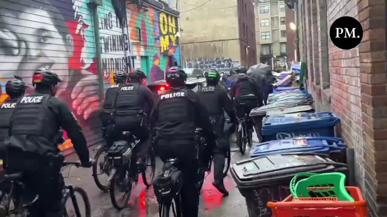 Extremely tense scene in Seattle after Antifa militants surrounded a police cruiser in an alley.