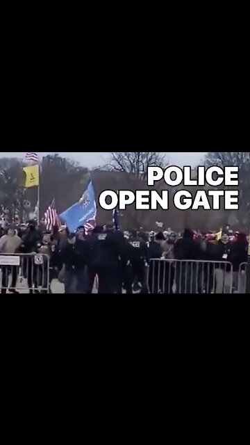 Law Enforcement Officer Opens Gate, Signaling Protesters To Walk Through To The Capitol Jan.6th
