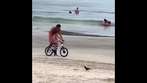 kid learning to ride his bike for first time