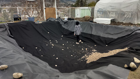 Day 13 of PyraPOD4 Grande-17 Backyard DIY: pond liner, drainage rocks, details on how to anchor