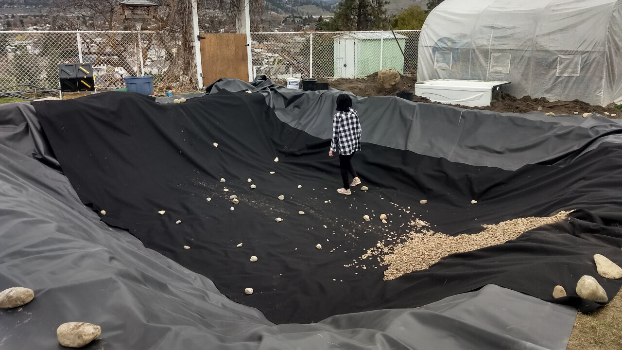 Day 13 of PyraPOD4 Grande-17 Backyard DIY: pond liner, drainage rocks, details on how to anchor