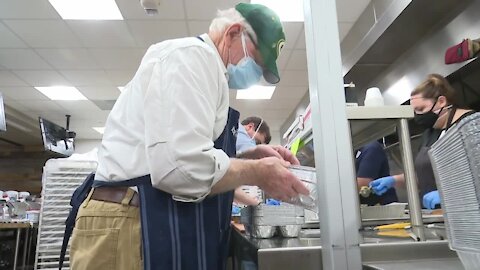 Volunteers pack Thanksgiving meals at Lambeau Field