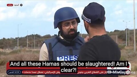 AN ISRAELI WAR CRIMINAL THREATENS A REPORTER LIVE ON AIR