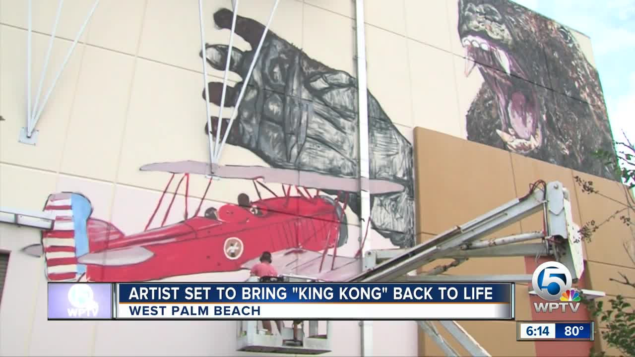 Artist painting King Kong mural in West Palm Beach