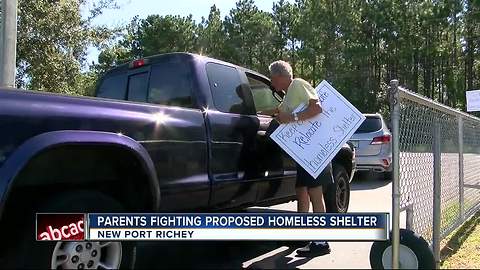 Residents go to school to protest homeless shelter location