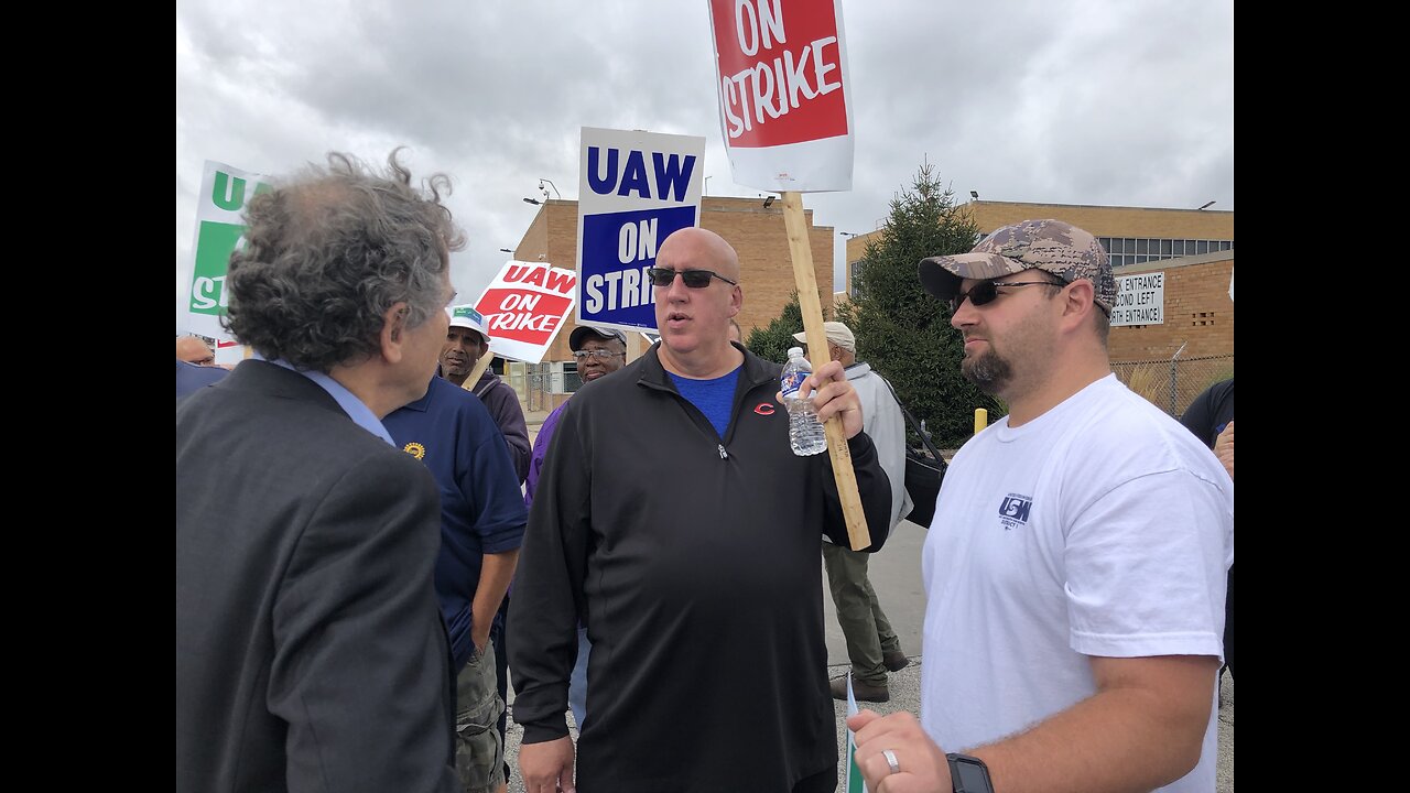 Sen. Sherrod Brown visits with striking workers at GM's Parma plant