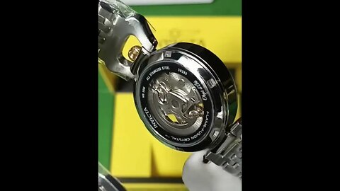 two tone automatic watch with exhibition case & an adjustable bracelet