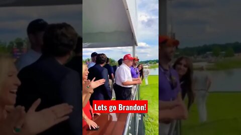 Crowd chants 'Let's go Brandon' at Trump golf tournament. MTG and Tucker smile.