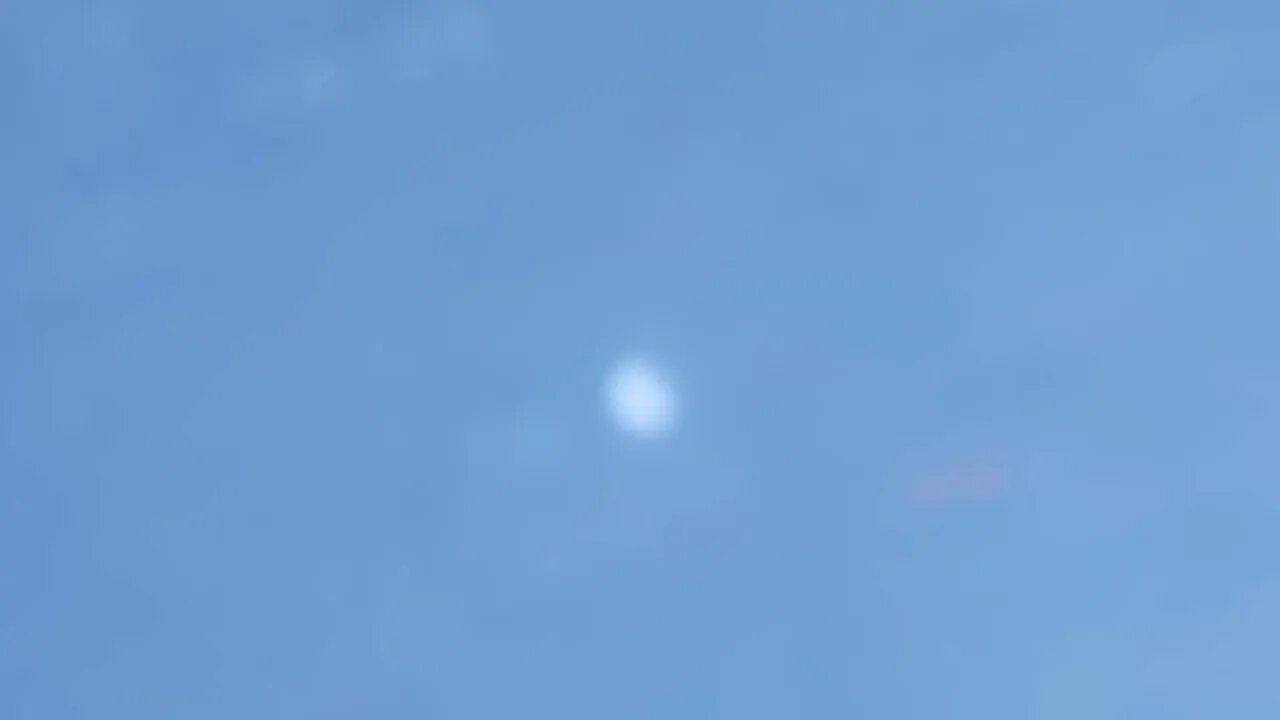 bright object rises out of gulf. plane in front