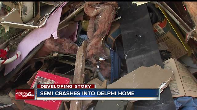 2 kids hurt in Carroll Co. crash; semi crashes into house