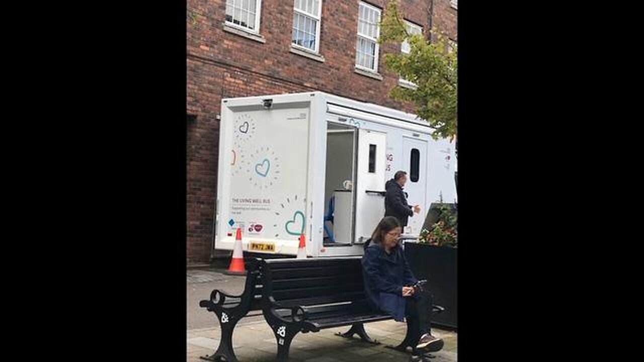 COVID VACCINATED WHEEL CHAIR BOUND TONY SHINGLER VISITS LOCAL EXTERMINATION BUS