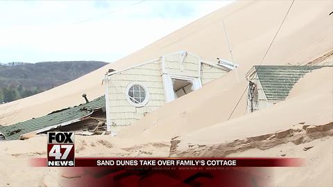 Lake Michigan sand dune threatens to cover another cottage