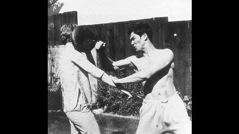 Cross kick Studio Films Bruce Lee picture 2 in his yard with Wife Linda