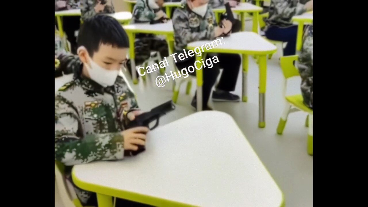 China - Children at school learn to handle weapons