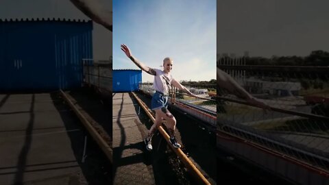 Cute Woman Balancing On A Railing