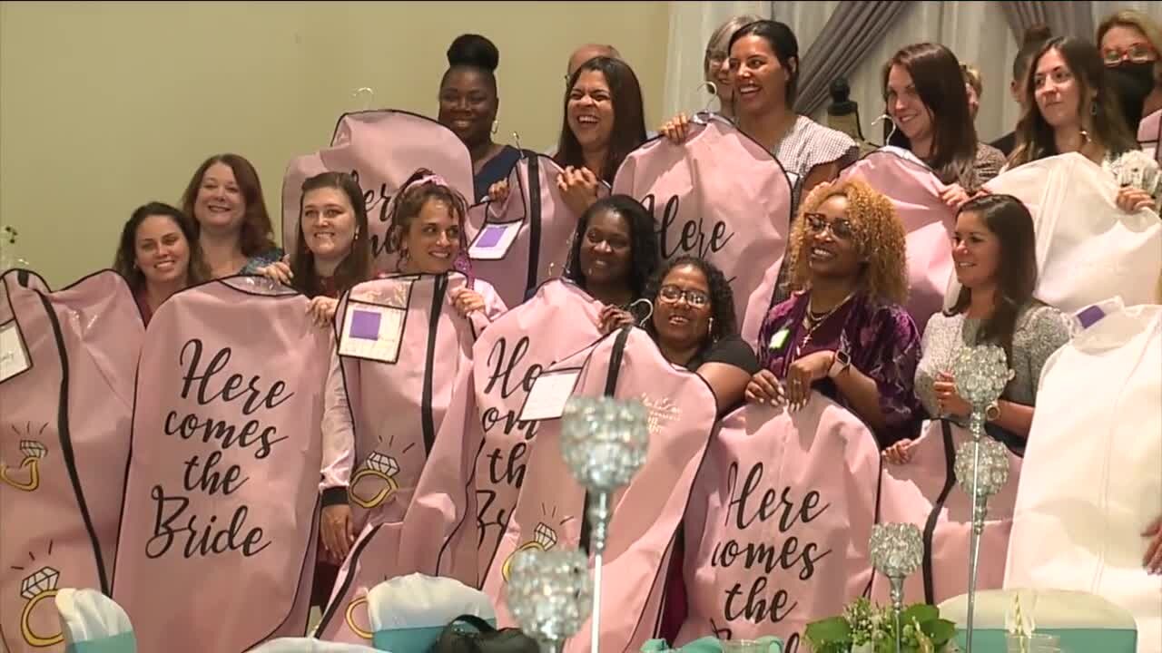 'Every dress has a story' | Hillsborough County teachers pick out free wedding dresses