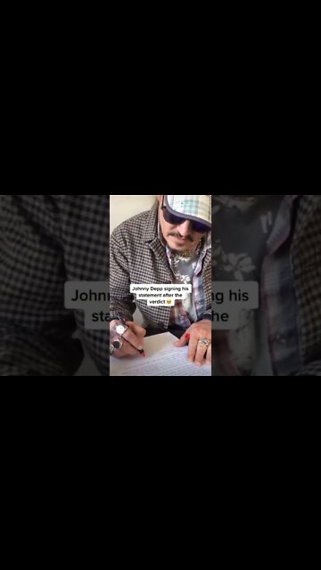 Johnny Depp signs his statement after the VERDICT #justiceforjohnnydepp