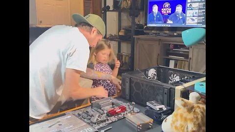 Dad and daughter build a computer