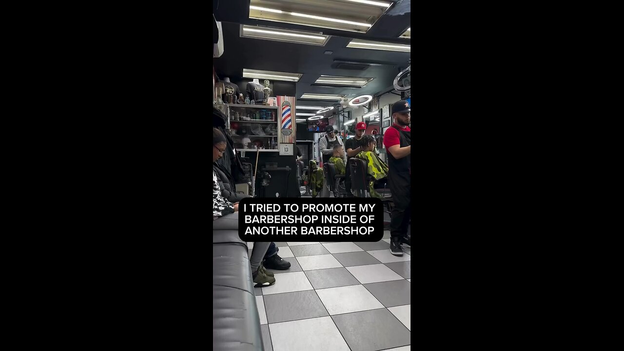 Barber promotes his barbershop inside another barbershop