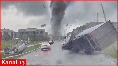A tornado tears through a roadway as Hurricane Milton makes landfall in Florida as Category 3 storm