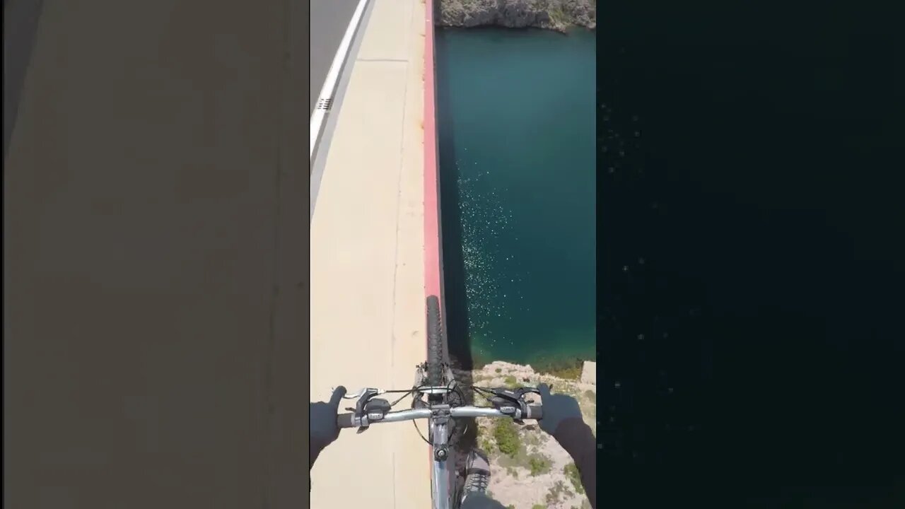 Cycling along a bridge railing 80 m above ground #shorts