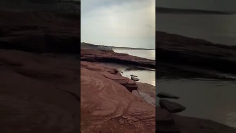 Climbing up rocky cliffs at the beach
