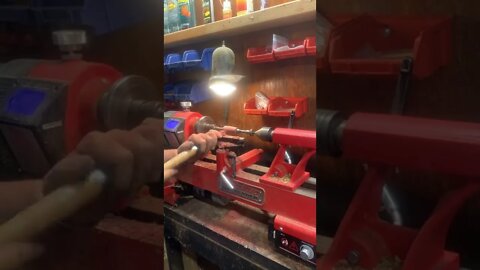 Turning wood on a lathe for a pen