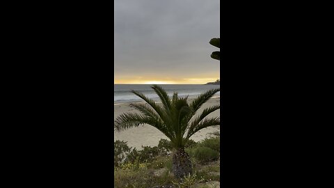 Beach waves and the sun setting