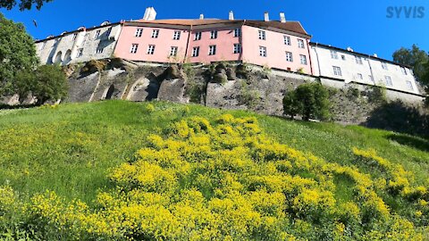 Pink House Atop A Wall Atop A Hill