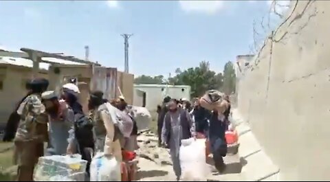 Prisoners Leaving Jail After Being Broken Out by Taliban