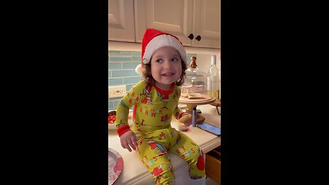 Toddler having a holly jolly good time