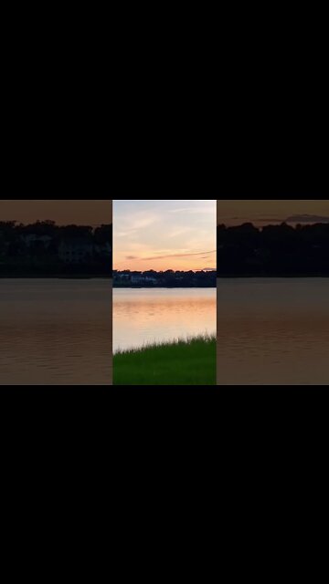 Watching the sunset by the water