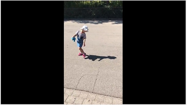 Little girl tries to run away from her own shadow