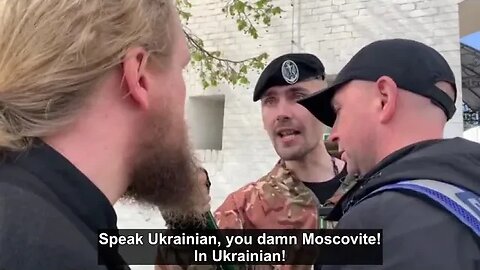 Ukrainian soldier insist a Swiss Christian wave the Ukrainian flag