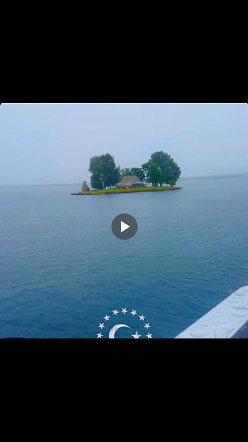 A tiny island with a single house seen in the middle of the sea in Canada.