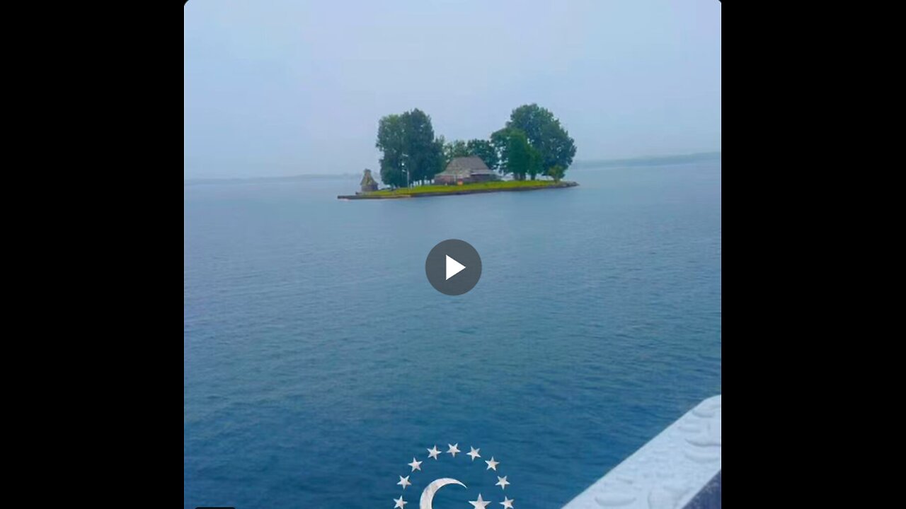 A tiny island with a single house seen in the middle of the sea in Canada.