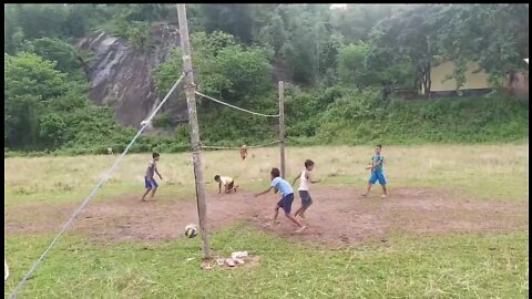 Cute Village boys playing volleyball